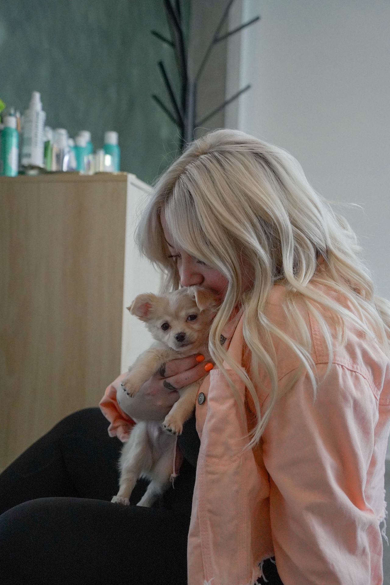 Sandy holding Prince, the Sunday Hair Co. salon puppy